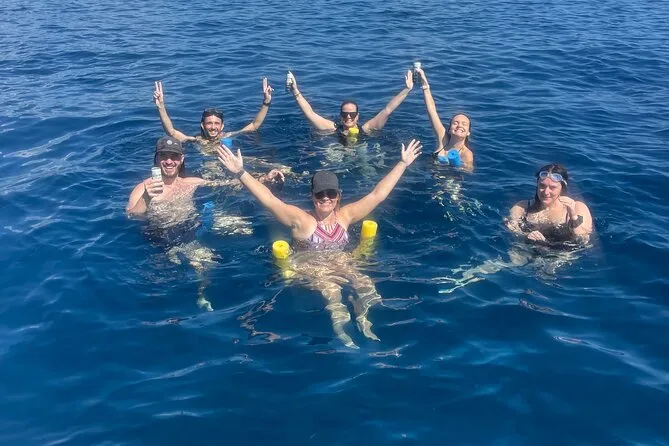 Spotted eagle ray gliding over the coral reef at Cistern Point on Cooper Island — one of the most reliable turtle and eagle ray snorkeling spots in the BVI near Tortola